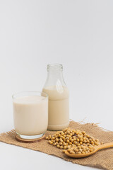 Health Benefits of Soy Milk,Soy milk in glass and soya bean isolated on white background