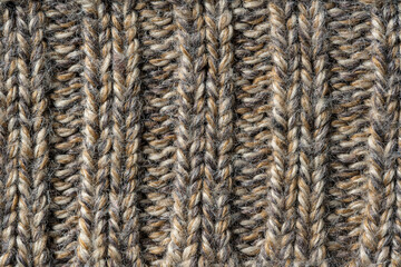 Knit fabric texture or background . Textile, scarf or sweater textured surface. Warm accessories, clothing, fashion concept. Closeup view