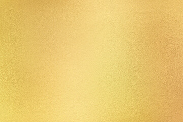 Gold wall texture background. Yellow shiny gold foil paint on wall surface with light reflection, vibrant golden luxury wallpaper - obrazy, fototapety, plakaty