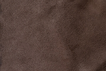 Dark brown cracked leather texture background
