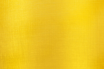 Golden textured background. Gold-plated, yellow material. Abstract image.