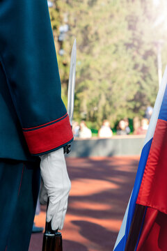 Guard of honor in service in Russia. The hand of a military man in a white glove holds a rifle with a bayonet. Conscripts.