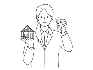 Smiling realtor hold house miniature and key 