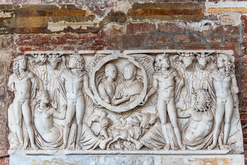Carved sculptures in marble decorating tomb of ancient roman old couple