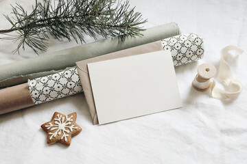 Christmas stationery. Empty greeting card, invitation mockup. Gingerbread cookie, green gift...