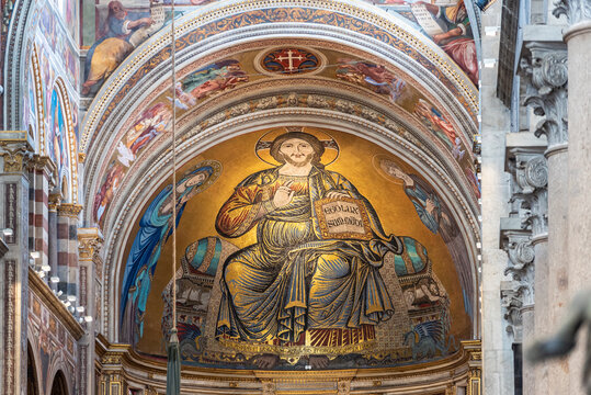 Religious fresco under arch inside catholic basilica in Pisa