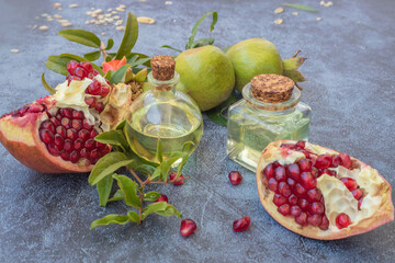 Pomegranate seed oil in a glass bottle on a table close-up.