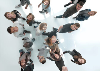 top view .groups of diverse young people moving towards each other