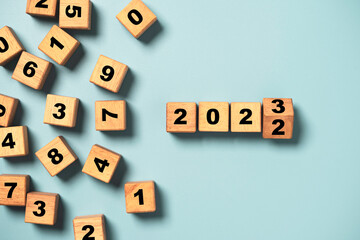 Flipping of wooden block cube to change 2022 to 2023 for merry Christmas and happy new year...