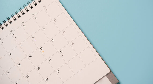 Top view of white calendar for business meeting and travel planing concept.