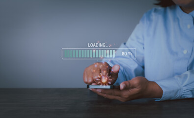 Close up woman using mobile smartphone for download application and waiting to loading. status loading bar symbol. woman downloading digital business data form website and cloud to smartphone. 