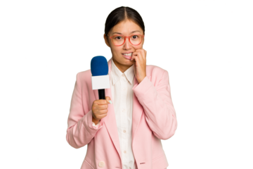 Young TV Asian presenter isolated on green chroma background biting fingernails, nervous and very anxious.