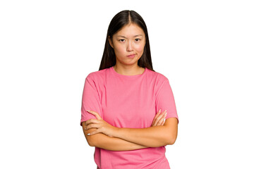Fototapeta premium Young Asian woman isolated on green chroma background frowning face in displeasure, keeps arms folded.