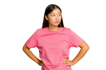 Young Asian woman isolated on green chroma background confused, feels doubtful and unsure.
