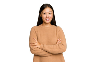 Young Asian woman isolated on green chroma background who feels confident, crossing arms with...