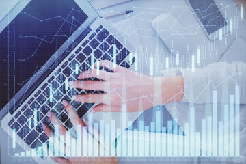 Double exposure of woman hands working on computer and forex chart hologram drawing. Top View. Financial analysis concept.