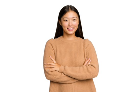 Young Asian woman isolated on green chroma background who feels confident, crossing arms with determination.