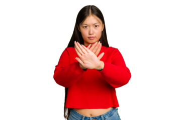Young Asian woman isolated on green chroma background standing with outstretched hand showing stop sign, preventing you.
