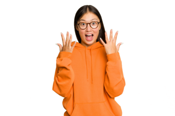 Young Asian woman isolated on green chroma background showing number ten with hands.