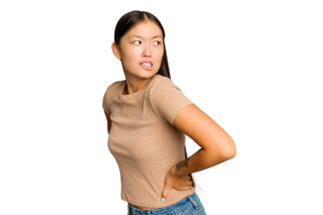 Young Asian woman isolated on green chroma background suffering a back pain.