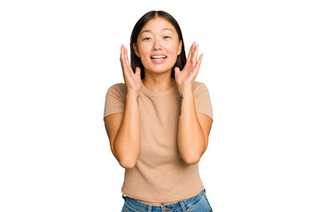 Fototapeta premium Young Asian woman isolated on green chroma background laughs out loudly keeping hand on chest.