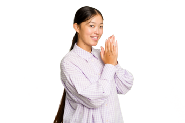 Young Asian woman isolated on green chroma background feeling energetic and comfortable, rubbing hands confident.