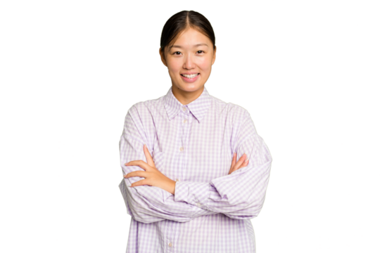 Young Asian woman isolated on green chroma background who feels confident, crossing arms with determination.