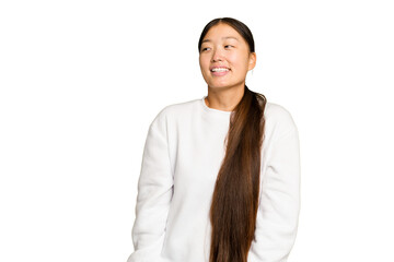Young Asian woman isolated on green chroma background relaxed and happy laughing, neck stretched...