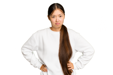 Young Asian woman isolated on green chroma background sad, serious face, feeling miserable and displeased.