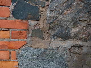 Stone and brick wall. The ruins of the buildings of the iron-smelting plant of the 19th century in the ore park "Tulmozerye" in the Pryazhinsky district of the Republic of Karelia, northwest Russia