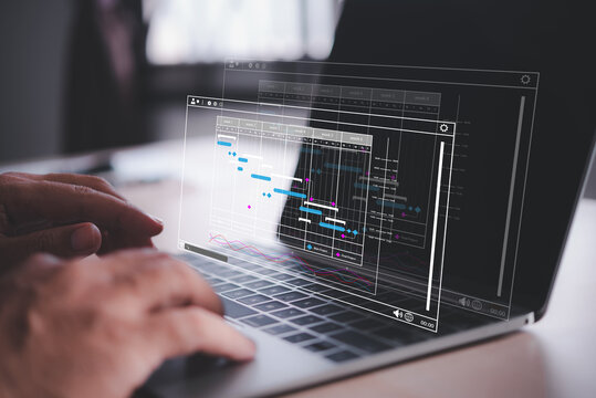 man using labtop , hand using laptop with virtual work schedule plan on screen