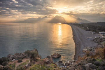 Antalya Beach and Taurus Mountains at sunset. Antalya, Turkey.