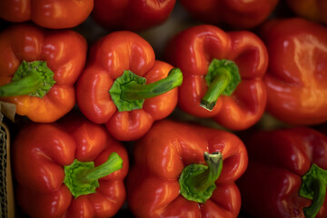 Red pepper on market. Juicy pepper top view. Vegetables in drawer. Healthy food.