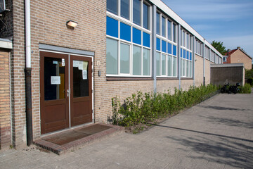 Fototapeta na wymiar Entrance Sporthall Schoolstraat Street At Diemen The Netherlands 8 May 2020