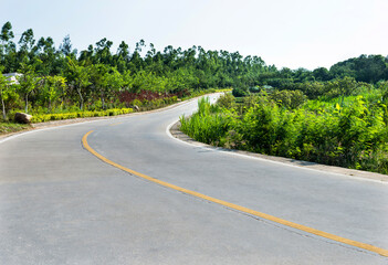 Fototapeta na wymiar Empty curved road on mountain