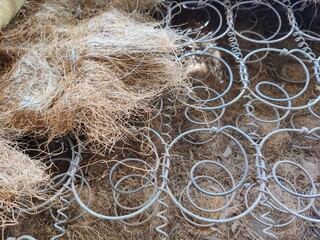 Old coil rusty springs of the mattress