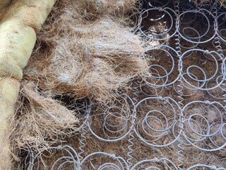 Old coil rusty springs of the mattress