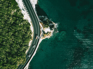 Aerial view of road going along  ocean or sea in Italy © NBLX