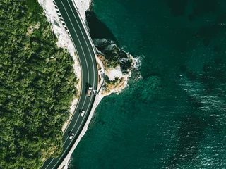 Fotobehang Aerial view of road going along  ocean or sea in Italy © nblxer