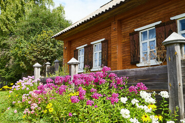 Fototapeta na wymiar An old village wooden house in summer day in Russia