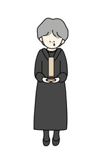 位牌を持って泣いている喪服の年配女性