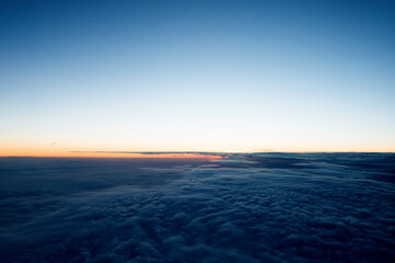 Fototapeta na wymiar Dark clouds from airplane window