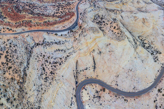 Drone view of asphalt road going through sandy valley in Utah