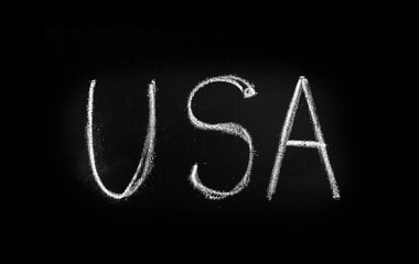 USA lettering in chalk on a blackboard. The inscription United States of America on the blackboard.