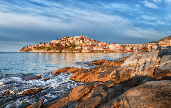 Morning in pier of Kavala city, Greece. Beautiful landscape of coastal line Mediterranean city Kavala in Greece