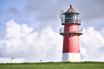 Lighthouse behind a dike in nothern Germany. High quality photo