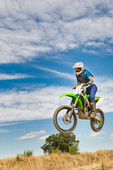 Fototapeta na wymiar Motocross rider jumping.