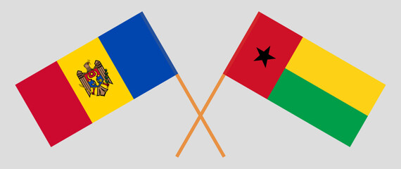 Crossed flags of Moldova and Guinea-Bissau. Official colors. Correct proportion