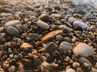 Large and small stones on the beach. Selective focus.