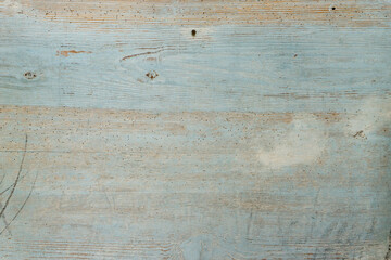 Naklejka premium Blue painted wooden surface is old and weathered.